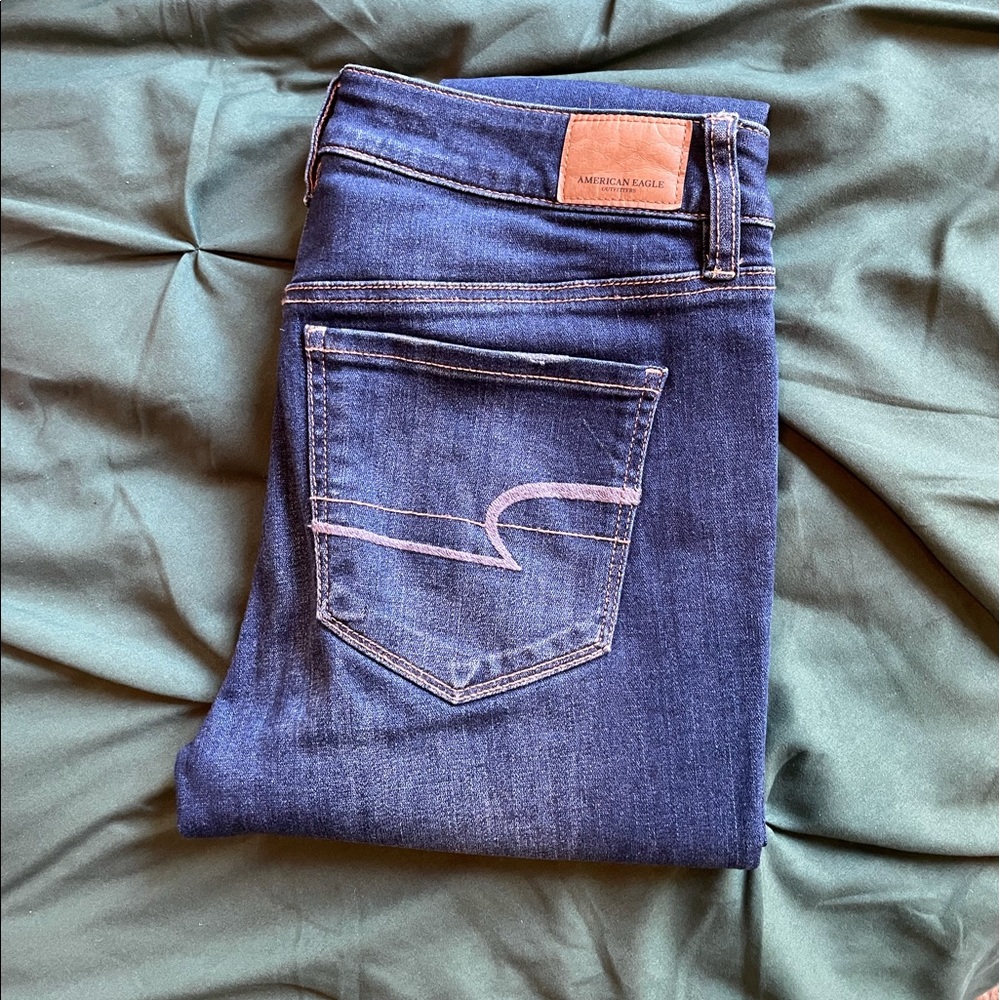America Eagle Distressed mid rise stretch jeans